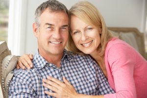 Man and woman after men's pelvic floor therapy and kegel chair treatment at UROSPOT